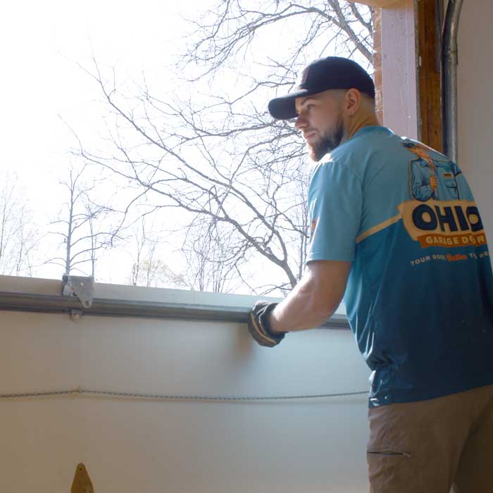 Local Garage Installation Brooklyn, OH Ohio Garage Door Repair technicians are installing a new garage door near Brooklyn, OH