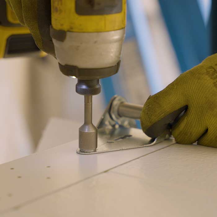 Ohio Garage Door Repair technician servicing garage door hardware in Auburn Township, Ohio