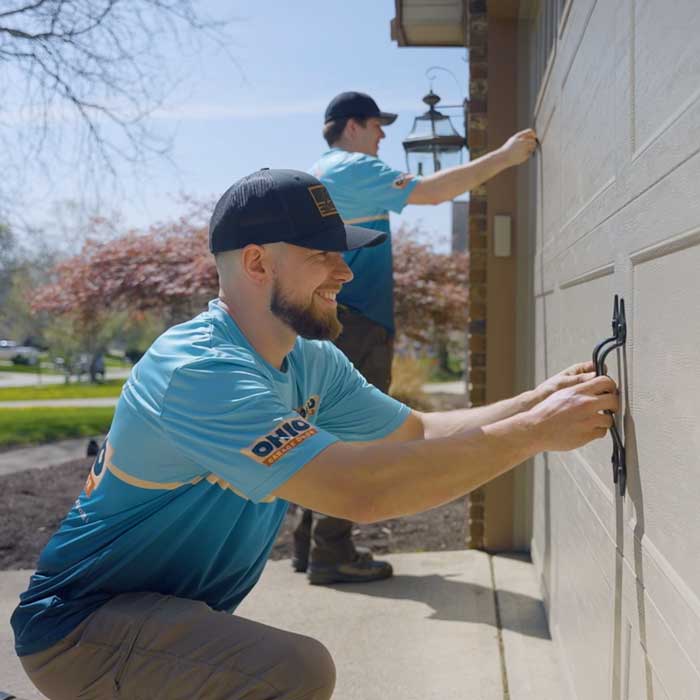 Ohio Garage Door Repair technicians are installing a new garage door near Berea, OH