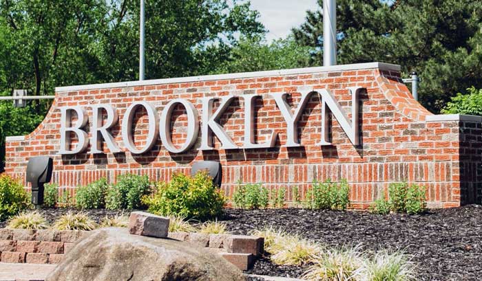 Garage Door Installation & Repair Brooklyn, OH A garage door repair technician is installing a new garage door spring near Brooklyn, OH
